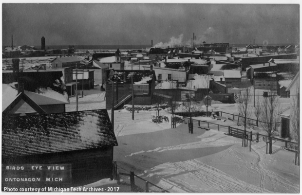 View of scattered wooden buildings in the snow