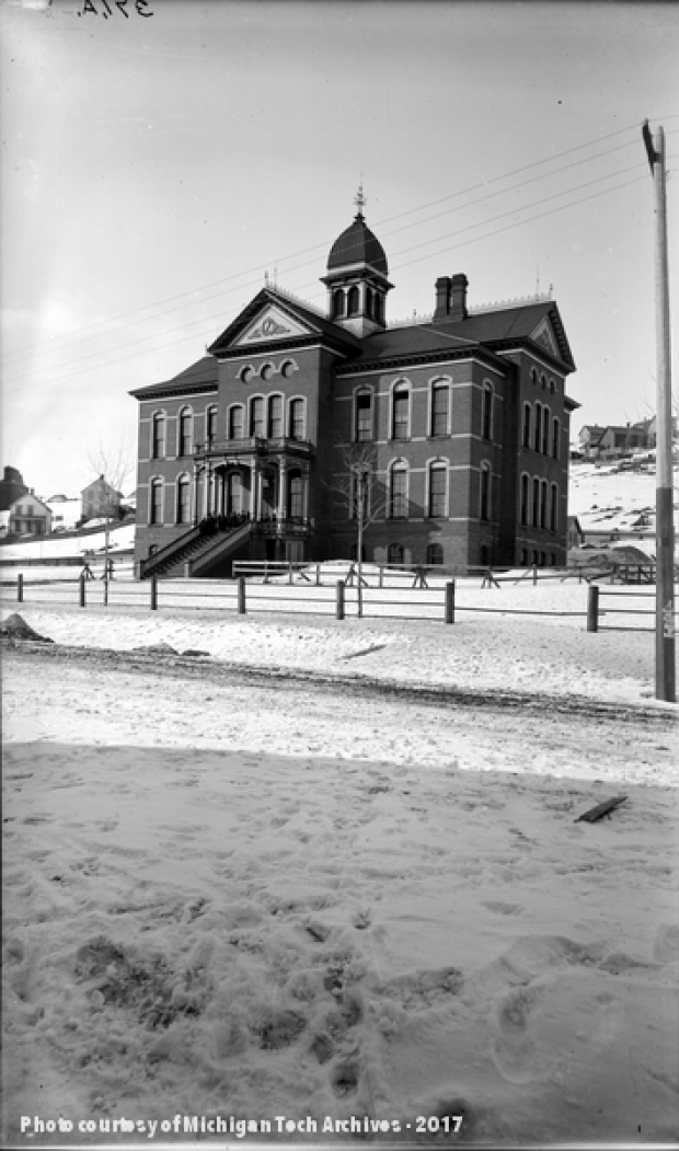 View of high school building in snow